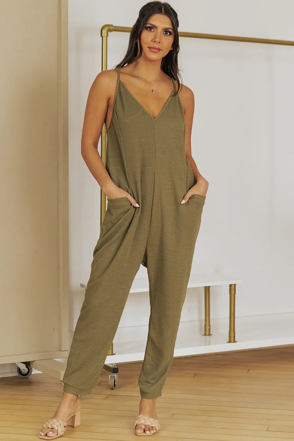 Spaghetti Strap Deep V Jumpsuit with Pockets Trendsi